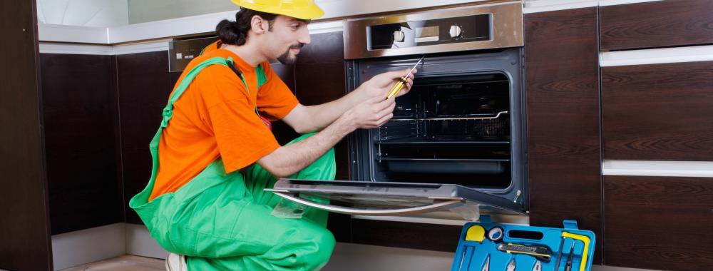 Repairman assembling the furniture at kitchen.jpg